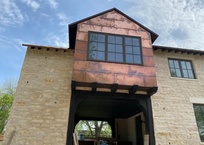 Copper metal panel facade on a stone building for Metal Roof Coating in Ladera Heights